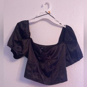 Black satin cropped top with puffy sleeves